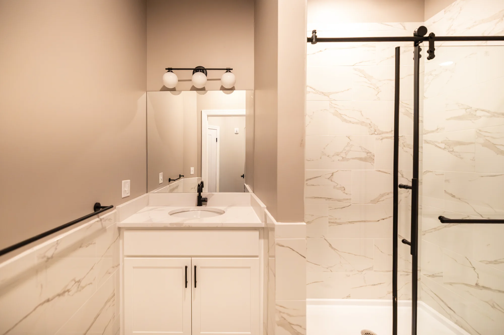 Marble-tiled bathroom in a JBAS Realty residence